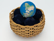 3D Earth and black Earth  in basket