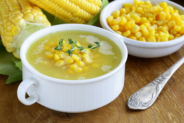 Poster - soup of fresh yellow corn served on a wooden table