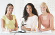 © tmc_photos - Teenage Girls With Microscope At Desk In Chemistry Class