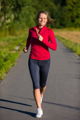 Wall Mural - Woman running outdoor