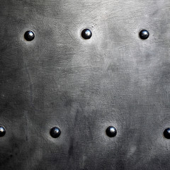 Black metal plate or armour texture with rivets