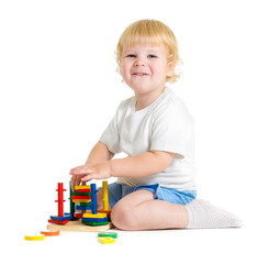 Fototapete - Happy child playing logical educational toys