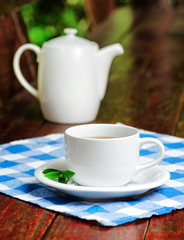 Sticker - Cup of tea on wooden table