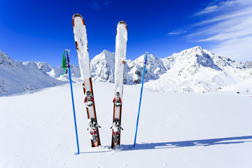 Fototapete - Ski, winter season, mountains and ski equipments on ski run
