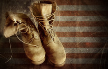 US Army Boots On The Old Paper Flag Background