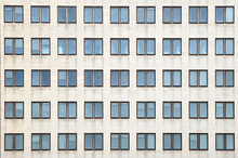 Multiple Closed Windows On A Large Office Building