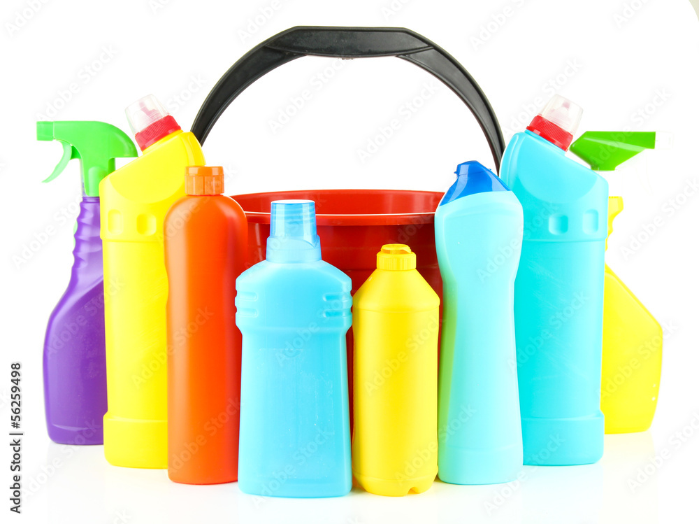 Colorful plastic detergent bottles with bucket, isolated