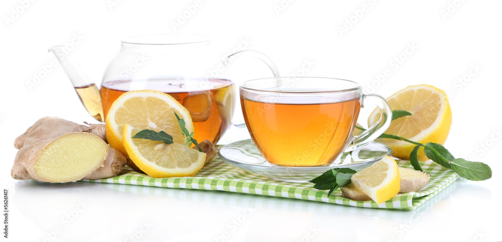 Kettle and cup of tea with ginger on napkin isolated on white