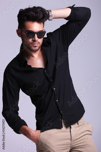 Fototapeta dla dzieci young fashion man adjusting hair