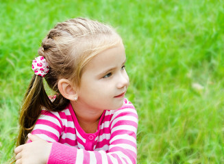 Portrait of thoughtful cute little girl looking away