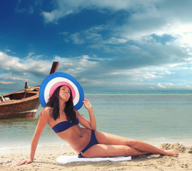 Wall Mural - Beautiful woman on the beach.