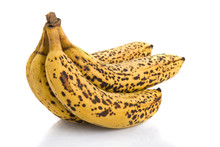 Cluster Of Over Ripe Bananas Isolated On White Background...