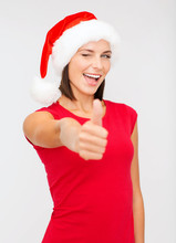 Woman In Santa Helper Hat Showing Thumbs Up