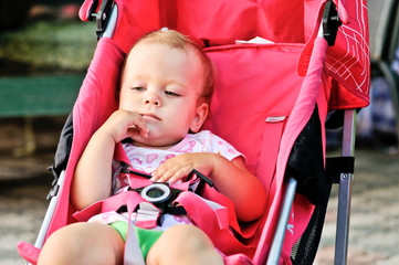 cute baby girl in stroller