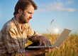 © pinkyone - Modern farmer with laptop on his wheat field