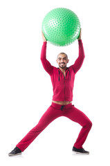 Wall Mural - Man with swiss ball doing exercises on white