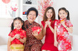© WONG SZE FEI - Multi generations Asian family celebrate Chinese new year