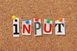 The word Input on a cork notice board