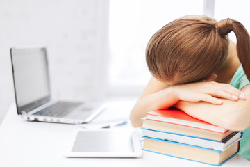 Canvas Print - tired student sleeping on stock of books