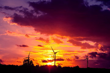 wind turbines at sunset