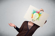 Woman holding a cardboard with paint splashes and lightbulb in f