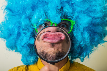 Wall Mural - crazy funny young man with blue wig