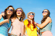 © adam121 - group of young people wearing sunglasses and hat