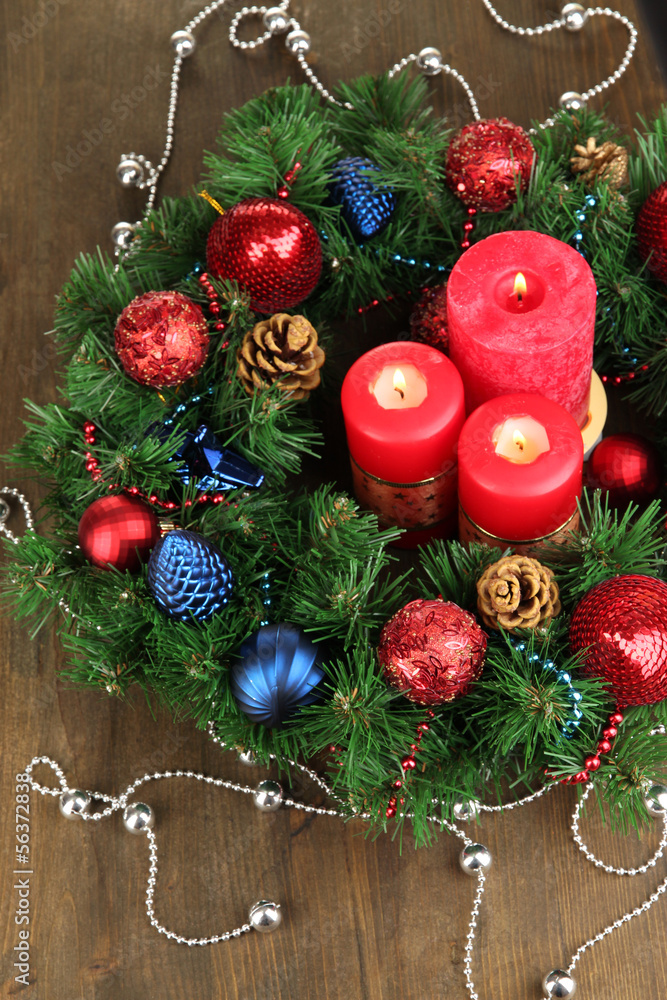 Beautiful Christmas wreath on wooden table close-up