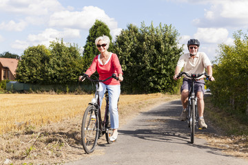 senior couple enjoying bike trip