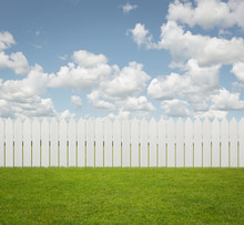 White Fence On The Grass With Copy Space
