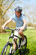 © Monkey Business - Young Boy Riding Bike Along Country Track