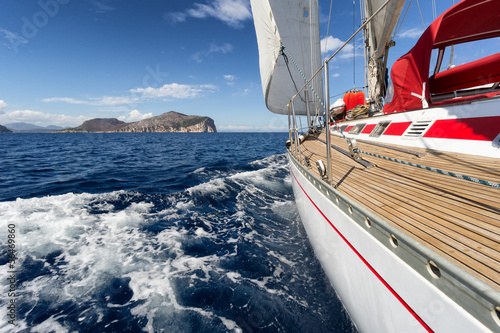 Naklejka - mata magnetyczna na lodówkę Sail Boat in Sardinia coast, Italy