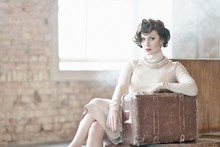 Beautiful Vintage Style Young Woman With Suitcase