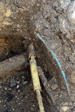 Underground Pipe Work Undergoing Repair In A Street In England.