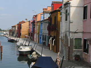 Colourful houses and boats in Burano, Venice, Italy