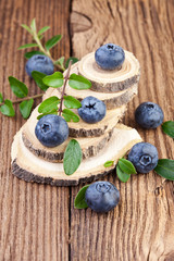 Canvas Print - Blueberries on wooden background