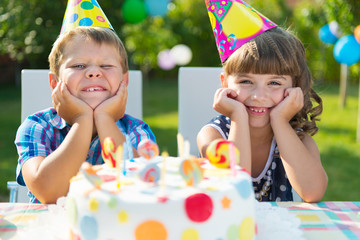 Happy children having fun at birthday party