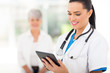 © michaeljung - female healthcare worker using tablet computer in hospital