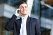 © Minerva Studio - Handsome businessman speaking on the phone