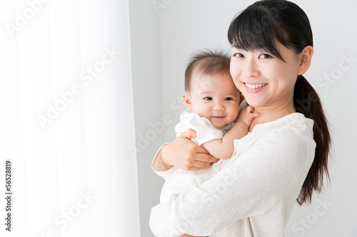 Fototapeta asian baby and mother relaxing