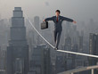 © Photobank - Businessman walking on Tightrope