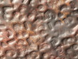 Stamped copper surface as background