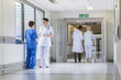 Doctors Nurses Hospital Corridor & Senior Female Patient