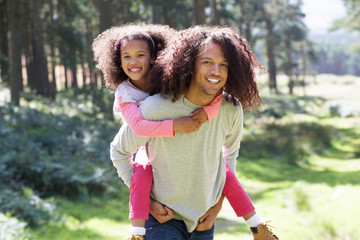 Wall Mural - Father Giving Daughter Ride On Shoulders In Countryside