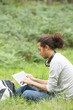 © micromonkey - Man Using Digital Tablet Whilst Hiking In Countryside