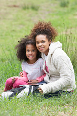 Wall Mural - Mother And Daughter Using Digital Tablet Countryside