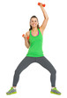 © Alliance - Full length portrait of smiling healthy woman making exercise