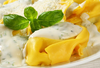 Wall Mural - Ricotta and spinach tortelloni with cream sauce and Parmesan