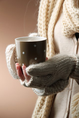 Poster - Female hands with hot drink, on color background