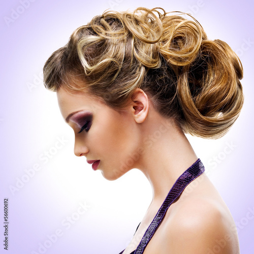 Fototapeta na wymiar Profile portrait of woman with fashion hairstyle